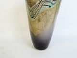 a vase that has a blue and green design on it