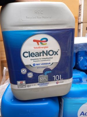 a bottle of clearnox sitting on top of a stack of blue containers