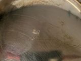 a close up of a silver plate with a mouse in it