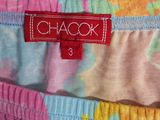 two pairs of colorful shorts with a red tag on them