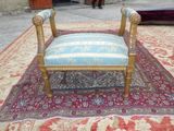 a chair that is sitting on a rug on the ground