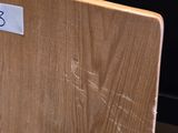 a wooden table with a sign on it in a room