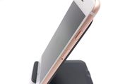 a cell phone that is sitting on top of a cell phone stand