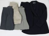 trois vêtements disposés sur une surface blanche