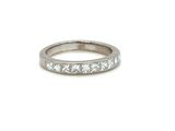 a close up of a diamond ring on a white background