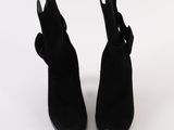they are two pairs of black boots with a bow on the side