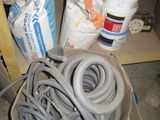 a pile of hoses and other items on the floor