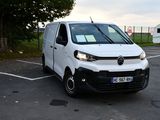 a white van that is parked in a parking lot