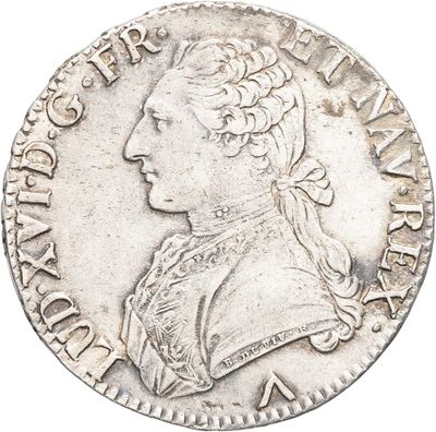 a close up of a silver coin with a woman ' s head