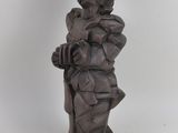 statue of a man with a hat and a cane on a white background
