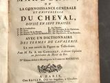 un livre ouvert avec l'image d'un cheval sur sa couverture