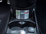 a close up of a car ' s dashboard with a sticker on it
