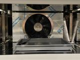 an image of a microwave with a fan inside of it