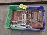 a box full of tools on the ground with a price tag
