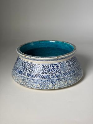 an image of a blue and white bowl sitting on a table
