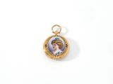 a close up of a small gold locke with a picture of a woman on it