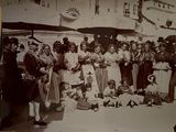 a black and white photo of a group of people posing for a picture