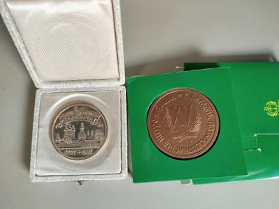 a small green box with a coin inside of it