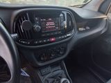the interior of a car with a dashboard and steering controls