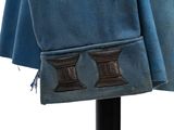 a blue cloth with a brown patch on it