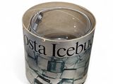 an image of a shot glass with a newspaper wrapper on it