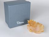 a box with a blue box and a yellow flower in it