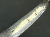 a close up of a metal object with a yellow substance on it