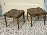 two small stools sitting next to each other on a tiled floor