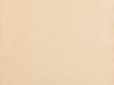 an old piece of paper with torn edges on a wooden table