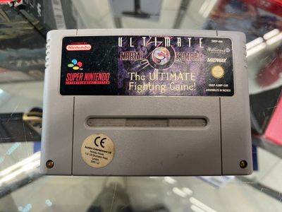 an old nintendo game console sitting on top of a glass table