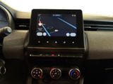 the dashboard of a car with a tablet on the dashboard