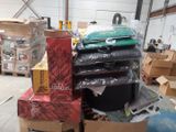 a pile of luggage sitting on top of a pile of boxes
