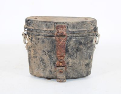 an old metal box with a handle on a white surface