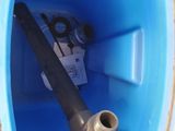 a pipe in the middle of a blue plastic container