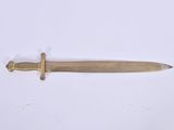 a small knife that is laying on a white surface
