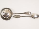 two spoons and a ladle on a white surface