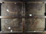 an old suitcase sitting on a wooden floor next to a wall