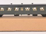 a toy train sitting on top of a cardboard box