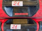 pair of red and black plastic luggage bags with numbers on them