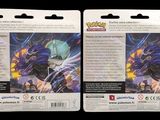 two packs of pokemon trading cards on a black background
