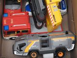 a box with a toy truck and a toy truck in it