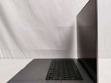 an open laptop computer sitting on top of a white table