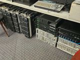 many electronic equipment on a shelf in a room