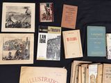 many old books on a black table with a black cloth