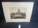 a black and white photo of a building with a clock tower
