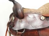 a saddle that has a brown seat and a brown seat