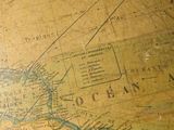 a close up of an old map on a table