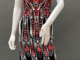 a mannequin wearing a black and red dress with red flowers on it