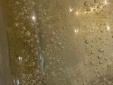 a close up of a glass with water in it