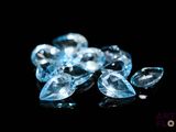 some very pretty blue diamonds on a black surface